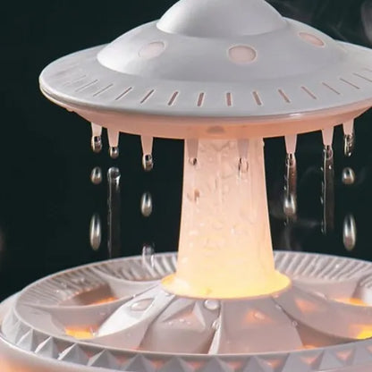 Raindrop Diffuser and Spaceship drop Humidifier in a modern minimalist room, releasing mist with soft ambient lighting.