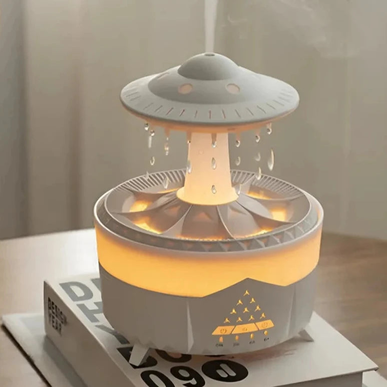 Raindrop Diffuser and Spaceship drop Humidifier in a modern minimalist room, releasing mist with soft ambient lighting.