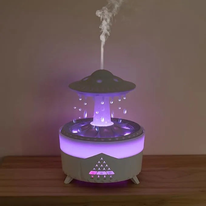 Raindrop Diffuser and Spaceship drop Humidifier in a modern minimalist room, releasing mist with soft ambient lighting.